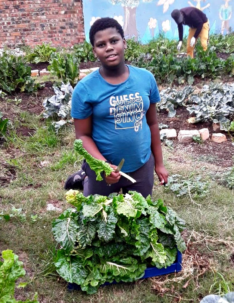A Young Man Working In The Garden